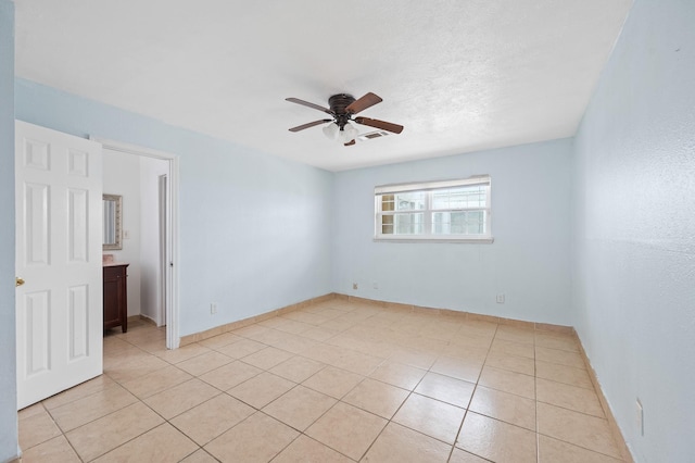 11707 N Nottingham Cir, Houston, TX 77071 - unfurnished room with ceiling fan, light tile patterned floors, and baseboards