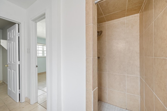 11707 N Nottingham Cir, Houston, TX 77071 - bathroom with a tile shower and tile patterned floors