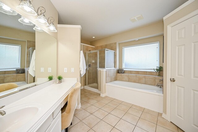 20803 Twisted Leaf Dr, Cypress, TX 77433 - bathroom featuring tile patterned flooring, a bath, vanity, and a stall shower