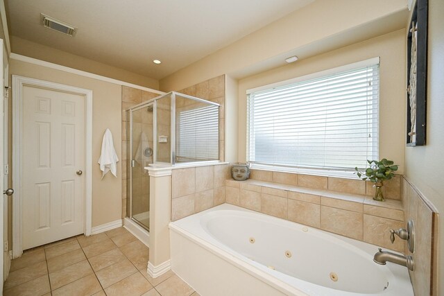 20803 Twisted Leaf Dr, Cypress, TX 77433 - bathroom featuring a jetted tub, a shower stall, and healthy amount of natural light