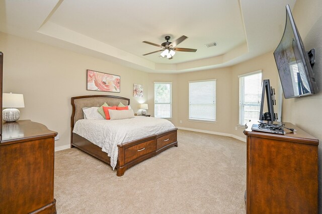 20803 Twisted Leaf Dr, Cypress, TX 77433 - bedroom featuring a tray ceiling, light carpet, and ceiling fan