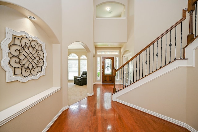 20803 Twisted Leaf Dr, Cypress, TX 77433 - foyer entrance featuring a towering ceiling, wood finished floors, and stairs