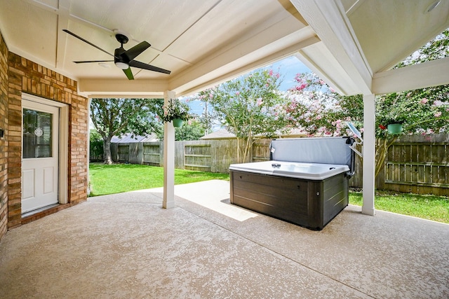20803 Twisted Leaf Dr, Cypress, TX 77433 - fenced backyard featuring a hot tub, a ceiling fan, and a patio