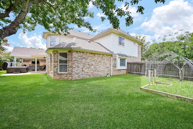 20803 Twisted Leaf Dr, Cypress, TX 77433 - rear view of property with a hot tub, a patio area, a fenced backyard, and brick siding