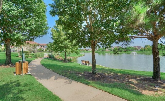 20803 Twisted Leaf Dr, Cypress, TX 77433 - surrounding community with a water view and a yard