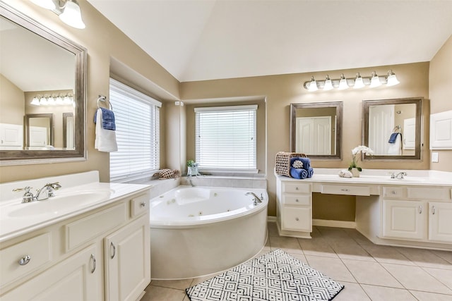 2231 Water Way, Seabrook, TX 77586 - bathroom with vaulted ceiling, a whirlpool tub, two vanities, and tile patterned flooring