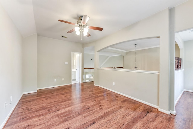 2231 Water Way, Seabrook, TX 77586 - spare room with ceiling fan, wood finished floors, and arched walkways