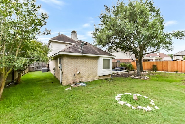 2231 Water Way, Seabrook, TX 77586 - back of property with brick siding, a shingled roof, a fenced backyard, and a chimney