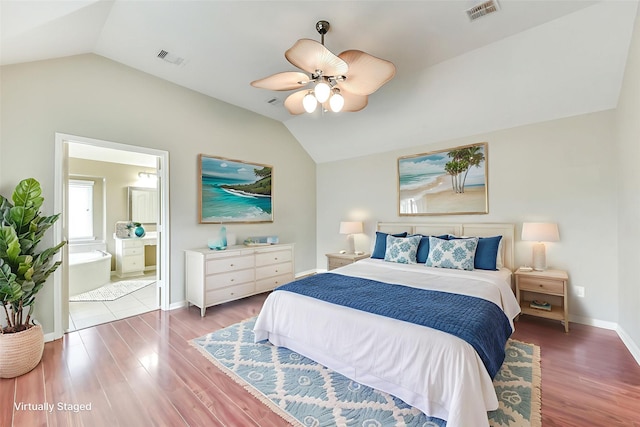 2231 Water Way, Seabrook, TX 77586 - bedroom with lofted ceiling, wood finished floors, ensuite bath, and ceiling fan