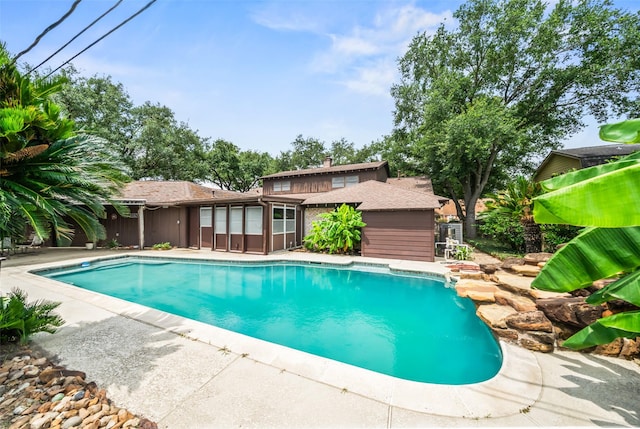 2709 Cherry Ln, Pasadena, TX 77502 - swimming pool featuring a patio area