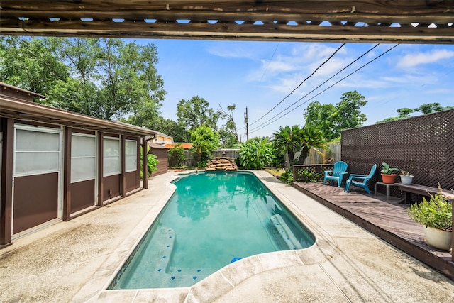 2709 Cherry Ln, Pasadena, TX 77502 - view of swimming pool with a fenced backyard and a patio