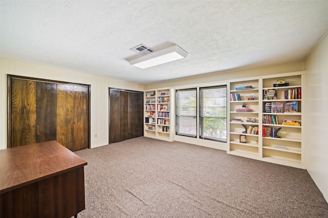 2709 Cherry Ln, Pasadena, TX 77502 - carpeted office featuring a textured ceiling
