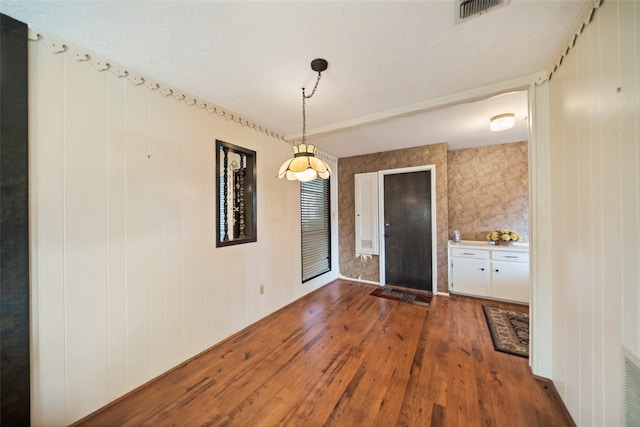 2709 Cherry Ln, Pasadena, TX 77502 - unfurnished dining area with dark wood-style flooring