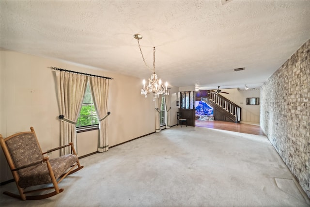 2709 Cherry Ln, Pasadena, TX 77502 - unfurnished dining area with a textured ceiling, carpet flooring, stairs, a chandelier, and a ceiling fan