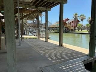 307 Anchor Dr, Freeport, TX 77541 - surrounding community with a water view and a dock