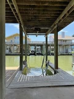 307 Anchor Dr, Freeport, TX 77541 - dock area featuring boat lift and a water view
