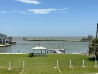 307 Anchor Dr, Freeport, TX 77541 - dock area with a water view and a yard