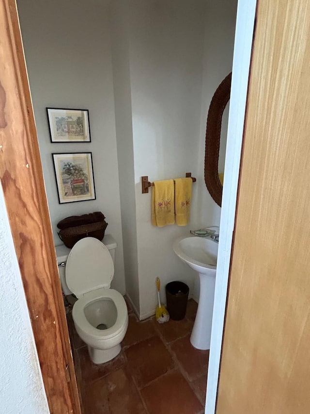 307 Anchor Dr, Freeport, TX 77541 - bathroom with tile patterned floors and toilet