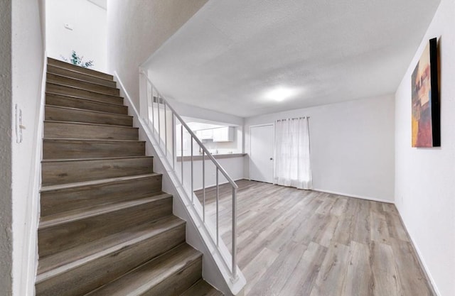 62 W Park W Dr, Houston, TX 77072 - stairway with wood finished floors and baseboards