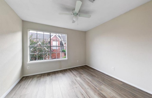 62 W Park W Dr, Houston, TX 77072 - spare room featuring wood finished floors, baseboards, and a ceiling fan