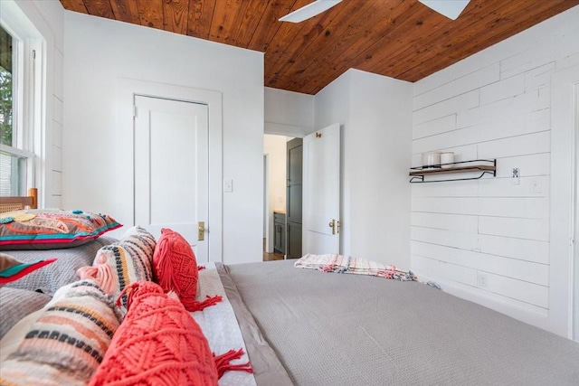 1604 S Austin St, Brenham, TX 77833 - bedroom with wood ceiling and wooden walls