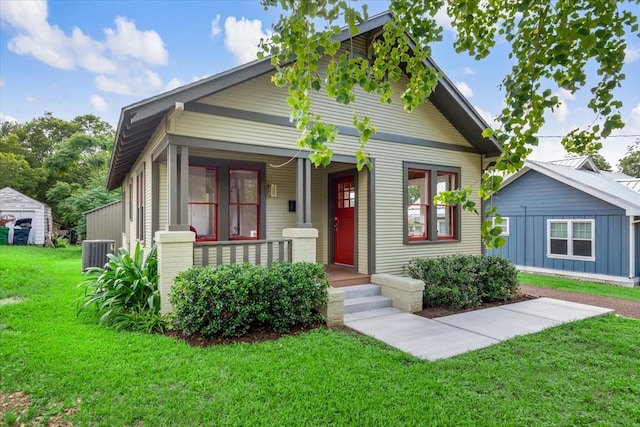 1604 S Austin St, Brenham, TX 77833 - bungalow featuring covered porch, cooling unit, and a front yard