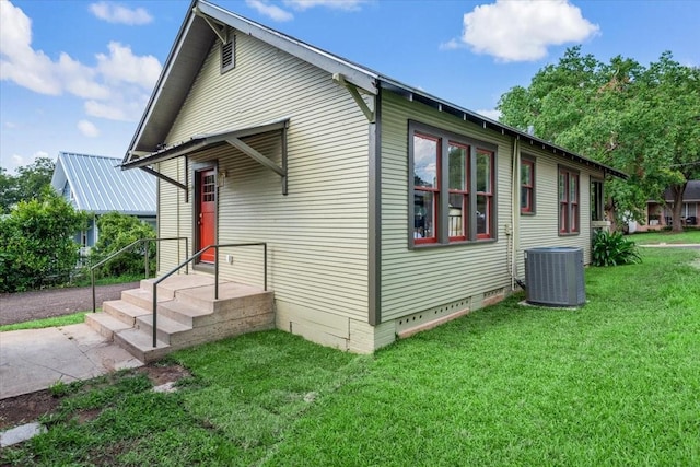 1604 S Austin St, Brenham, TX 77833 - view of property exterior featuring crawl space, a yard, and central air condition unit