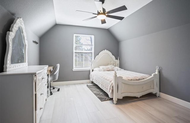 148 Wagon Pass Dr, Huntsville, TX 77340 - bedroom featuring light wood-style floors, lofted ceiling, a ceiling fan, and baseboards