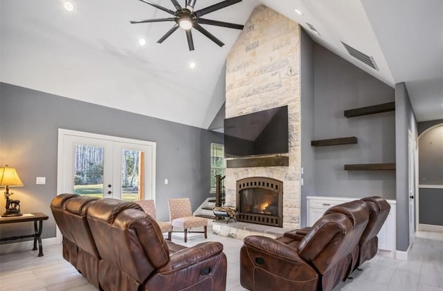 148 Wagon Pass Dr, Huntsville, TX 77340 - living room with ceiling fan, high vaulted ceiling, baseboards, a fireplace, and french doors