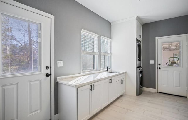 148 Wagon Pass Dr, Huntsville, TX 77340 - foyer featuring stacked washer / dryer