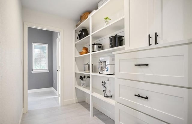 148 Wagon Pass Dr, Huntsville, TX 77340 - corridor featuring baseboards