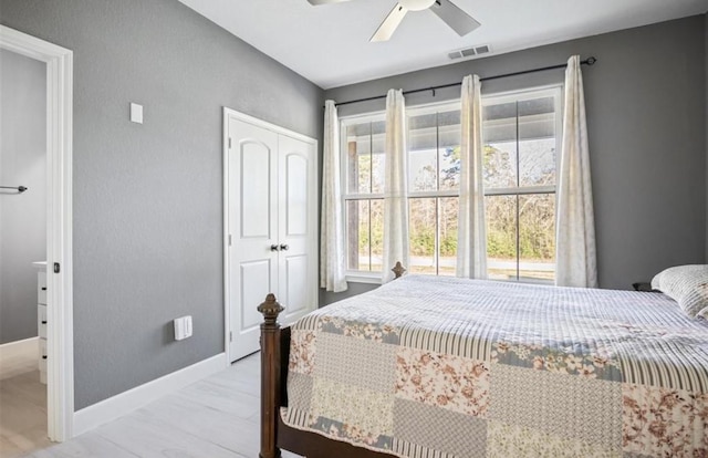 148 Wagon Pass Dr, Huntsville, TX 77340 - bedroom with a closet, baseboards, and ceiling fan