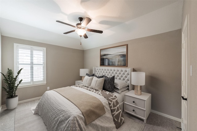20722 Lavone Dr, Porter, TX 77365 - bedroom featuring baseboards, light carpet, ceiling fan, and vaulted ceiling