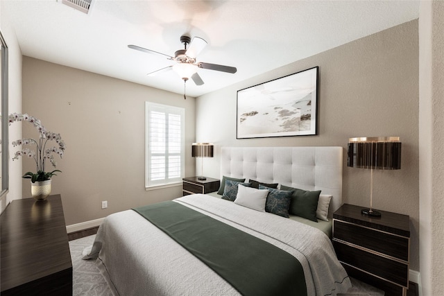 20722 Lavone Dr, Porter, TX 77365 - bedroom featuring wood finished floors, baseboards, and a ceiling fan