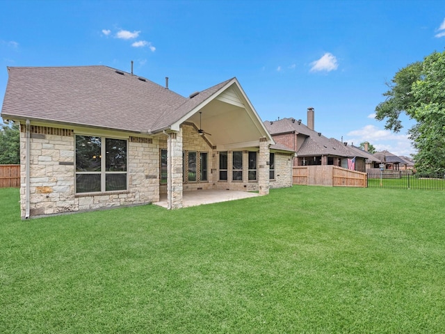 20722 Lavone Dr, Porter, TX 77365 - rear view of house with stone siding, a ceiling fan, roof with shingles, and a patio area