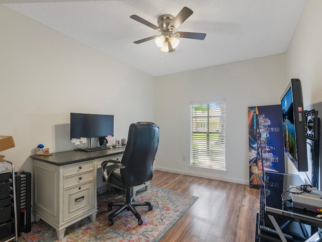 16414 Cavendish Dr, Houston, TX 77059 - office featuring a ceiling fan, wood finished floors, baseboards, and a textured ceiling