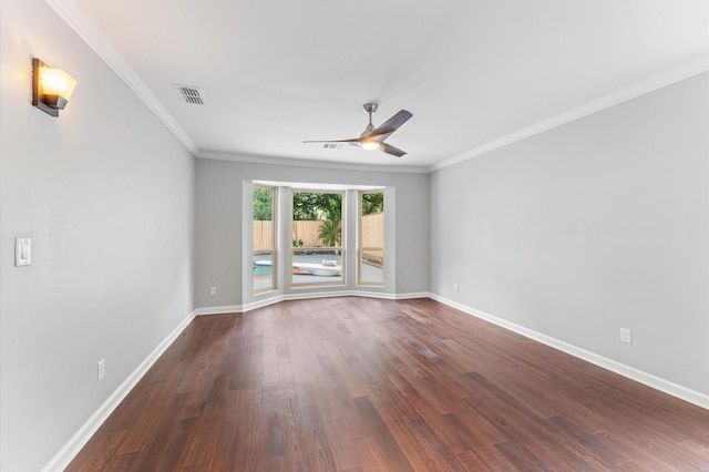 10714 Deerwood Rd, Houston, TX 77042 - spare room with a ceiling fan, dark wood-style flooring, and ornamental molding