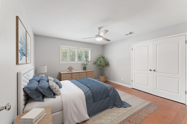 10714 Deerwood Rd, Houston, TX 77042 - bedroom featuring wood finished floors and ceiling fan