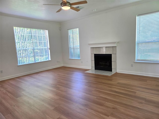 3307 Twelve Oaks Ln, Missouri City, TX 77459 - unfurnished living room with ceiling fan, ornamental molding, wood finished floors, and healthy amount of natural light