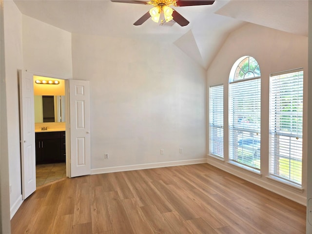 3307 Twelve Oaks Ln, Missouri City, TX 77459 - empty room with light wood finished floors, plenty of natural light, a ceiling fan, and lofted ceiling