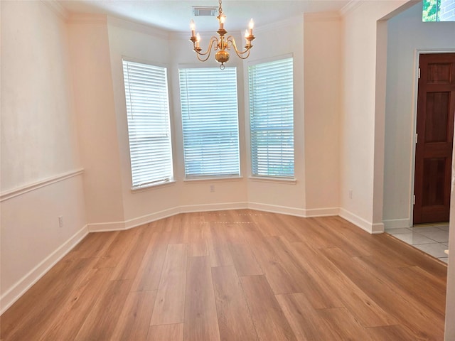 3307 Twelve Oaks Ln, Missouri City, TX 77459 - spare room featuring a chandelier, light wood-type flooring, and ornamental molding