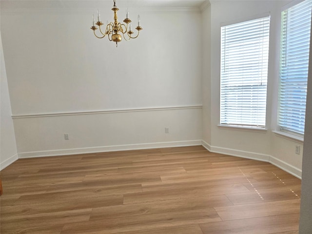 3307 Twelve Oaks Ln, Missouri City, TX 77459 - unfurnished room with a chandelier and light wood-style flooring