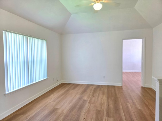 3307 Twelve Oaks Ln, Missouri City, TX 77459 - empty room with vaulted ceiling, ceiling fan, and light wood finished floors
