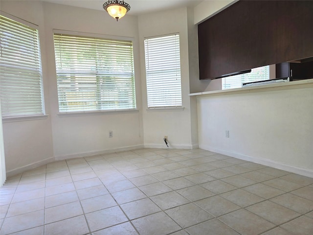 3307 Twelve Oaks Ln, Missouri City, TX 77459 - unfurnished dining area featuring light tile patterned flooring and healthy amount of natural light