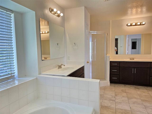 3307 Twelve Oaks Ln, Missouri City, TX 77459 - full bathroom featuring a stall shower, a garden tub, vanity, and tile patterned floors