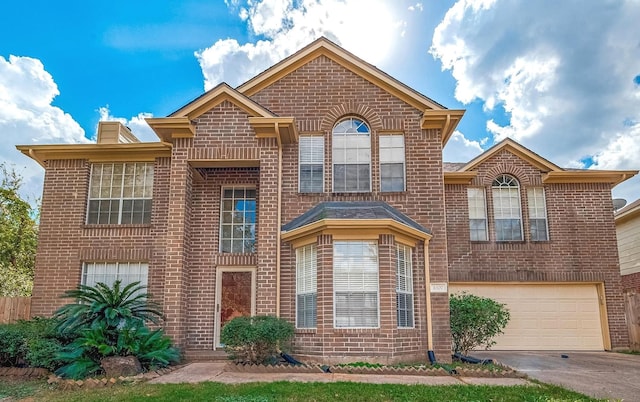 3307 Twelve Oaks Ln, Missouri City, TX 77459 - view of front of property featuring brick siding, an attached garage, and driveway