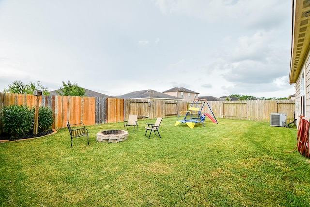 980 Lake View Cir W, Brookshire, TX 77423 - view of yard with a fire pit and central AC unit