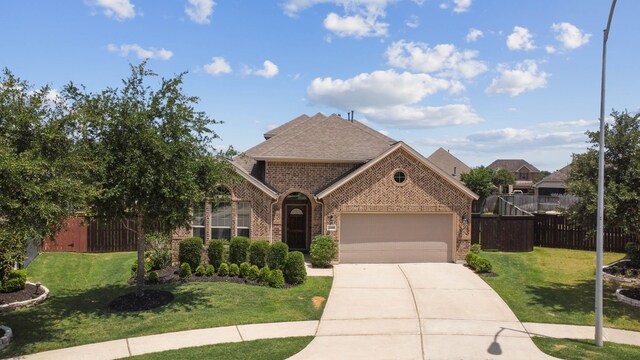 2206 Wolf Creek Ct, Katy, TX 77493 - view of front of home featuring brick siding, driveway, and a garage