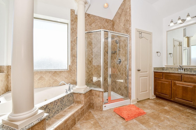 19707 Mission Pines Ln, Richmond, TX 77407 - full bathroom with decorative columns, a jetted tub, and a stall shower