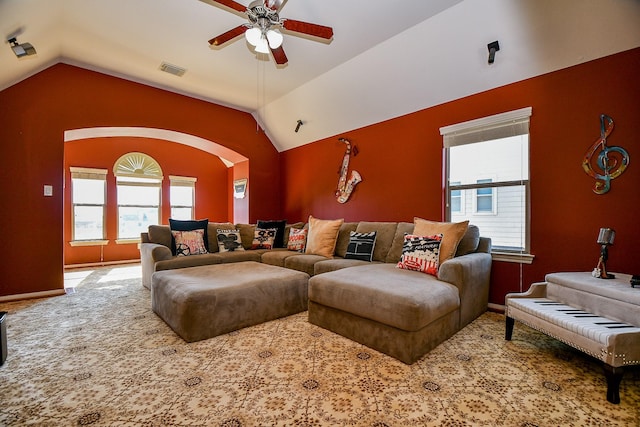 19707 Mission Pines Ln, Richmond, TX 77407 - living area with ceiling fan, vaulted ceiling, arched walkways, carpet, and baseboards